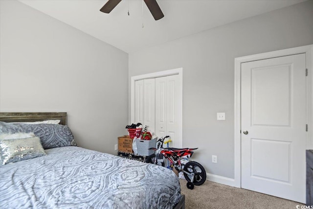 bedroom with ceiling fan, a closet, and carpet floors