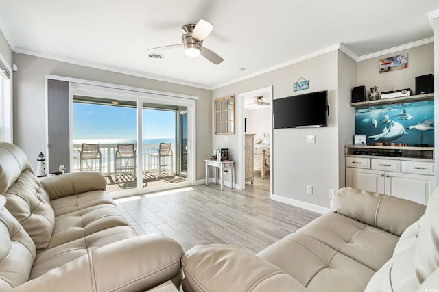 living room featuring ceiling fan, crown molding, and light hardwood / wood-style flooring