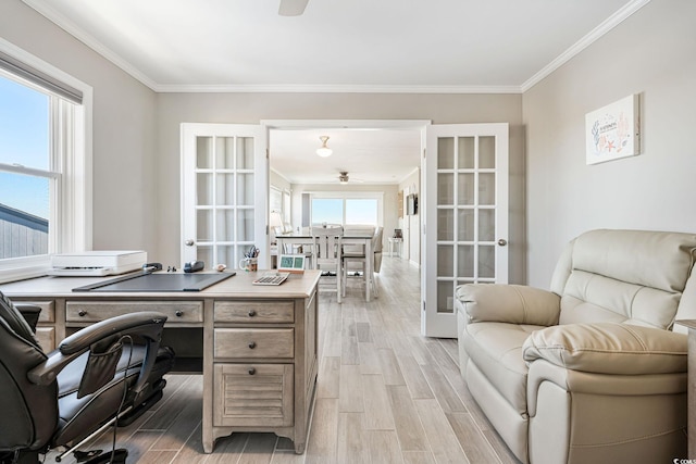 office with light wood-type flooring, french doors, and plenty of natural light