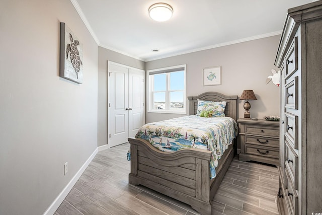 bedroom with a closet and crown molding