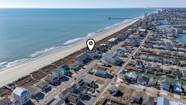 bird's eye view featuring a view of the beach and a water view