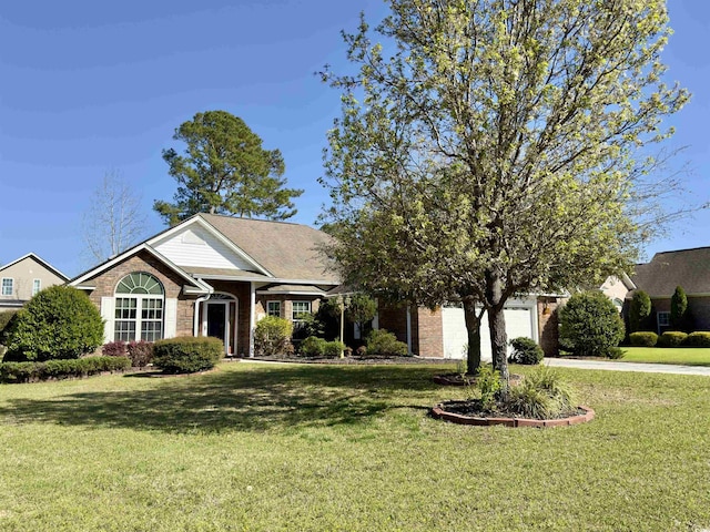 view of front facade featuring a front yard and a garage