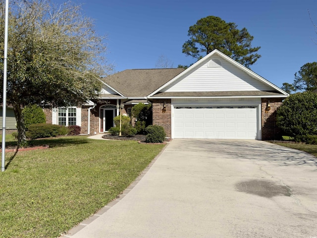 view of front of property featuring a garage and a front yard