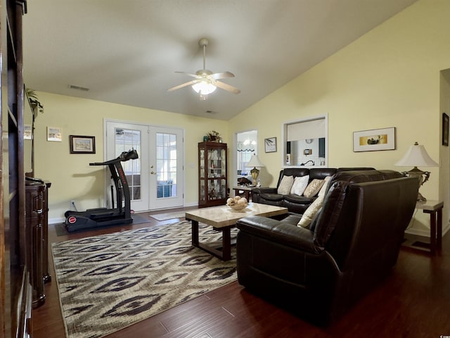 living room featuring ceiling fan, dark hardwood / wood-style flooring, lofted ceiling, and french doors