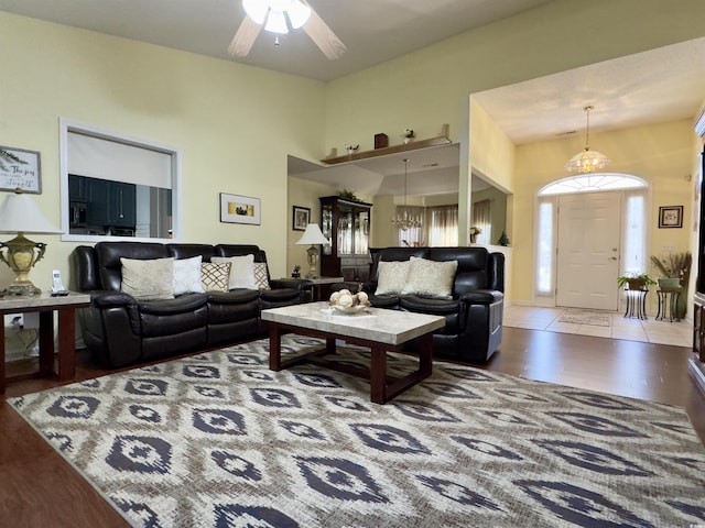 living room featuring ceiling fan and hardwood / wood-style flooring