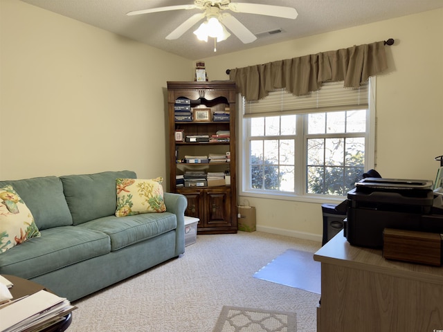 office area with light carpet and ceiling fan