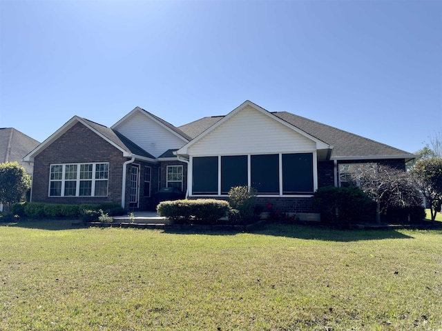 ranch-style house with a front lawn