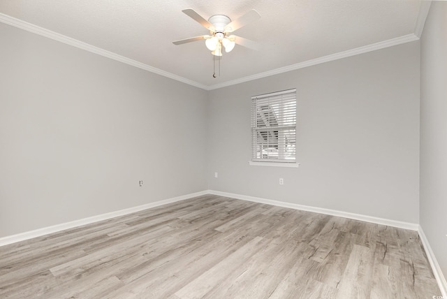 empty room featuring ceiling fan, a textured ceiling, ornamental molding, and light wood-type flooring