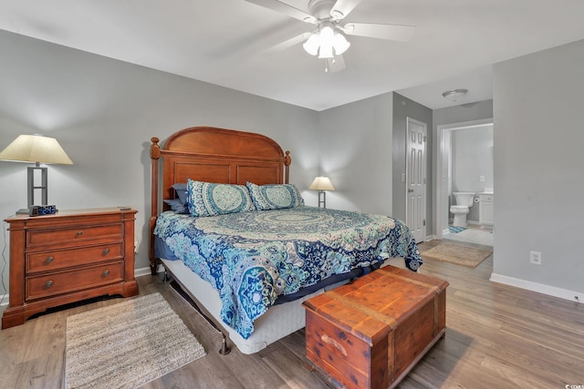 bedroom featuring ceiling fan, wood-type flooring, and connected bathroom