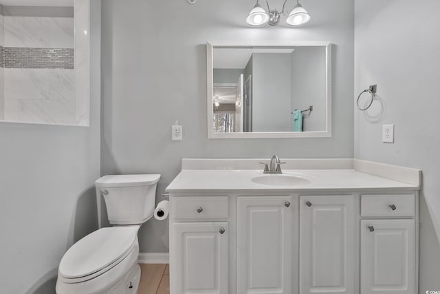 bathroom with toilet and vanity