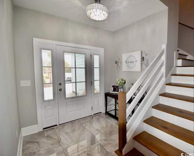 entrance foyer featuring a chandelier