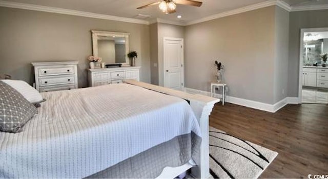 bedroom with dark wood-type flooring, ceiling fan, crown molding, and connected bathroom