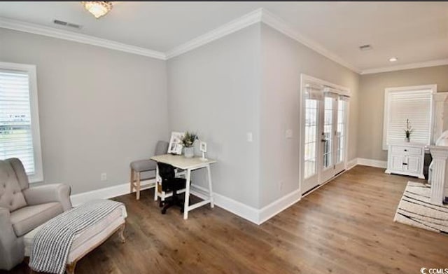 office space featuring french doors, dark hardwood / wood-style floors, and crown molding