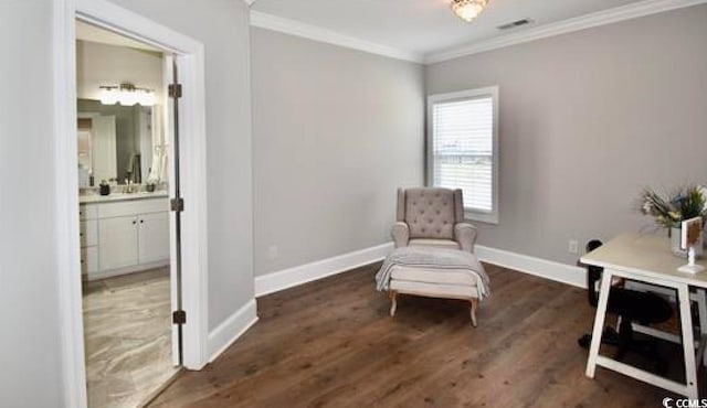 living area featuring ornamental molding and dark hardwood / wood-style floors