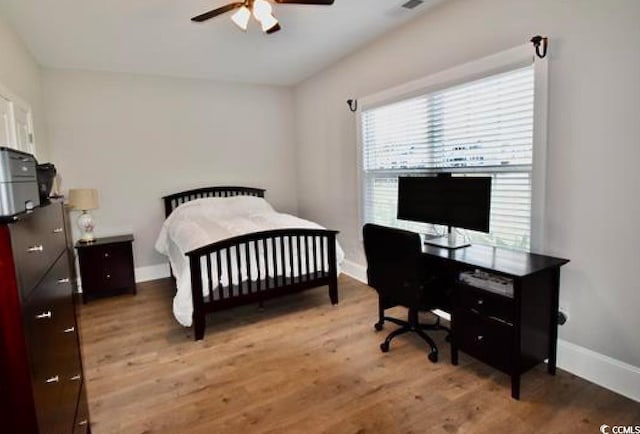 bedroom featuring ceiling fan and light hardwood / wood-style flooring