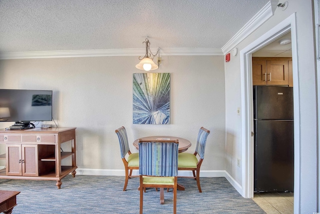 dining room featuring a textured ceiling, crown molding, and light tile patterned floors