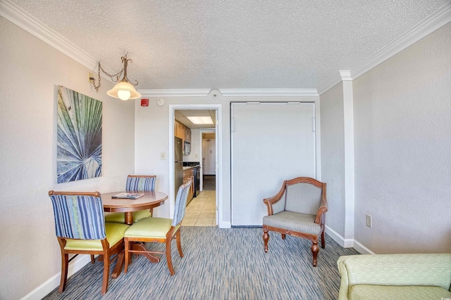 dining room featuring a textured ceiling and crown molding