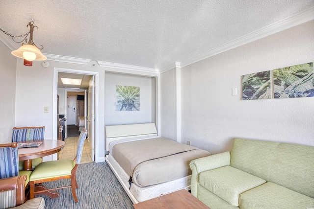 bedroom with a textured ceiling and ornamental molding