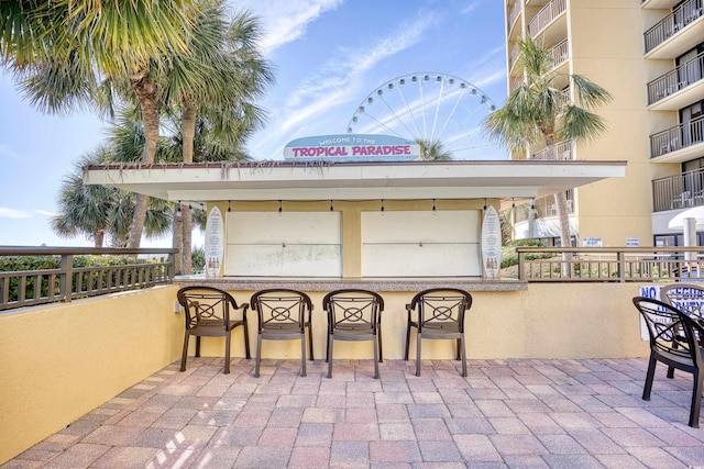 view of patio / terrace featuring an outdoor bar