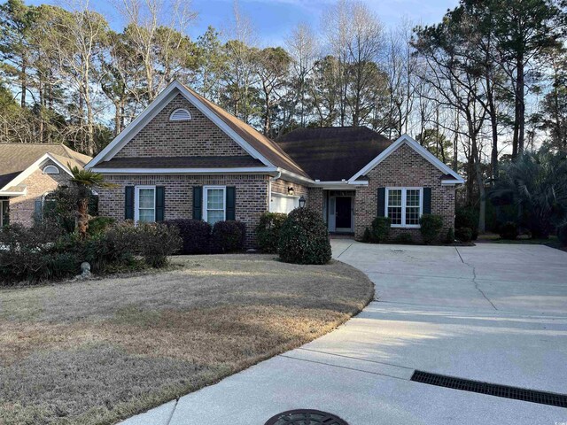 ranch-style house with a front yard