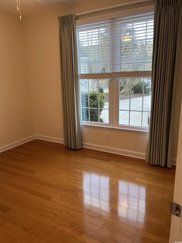 35 Dornoch Dr, Pawleys Island, SC 29585 - spare room featuring baseboards and wood finished floors