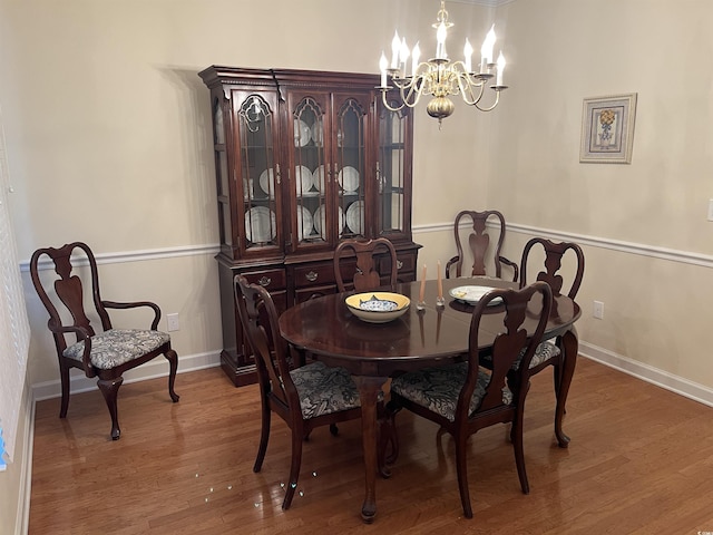 35 Dornoch Dr, Pawleys Island, SC 29585 - dining space featuring an inviting chandelier, baseboards, and wood finished floors