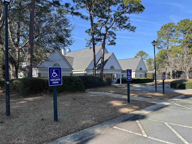 35 Dornoch Dr, Pawleys Island, SC 29585 - view of road featuring traffic signs and street lights