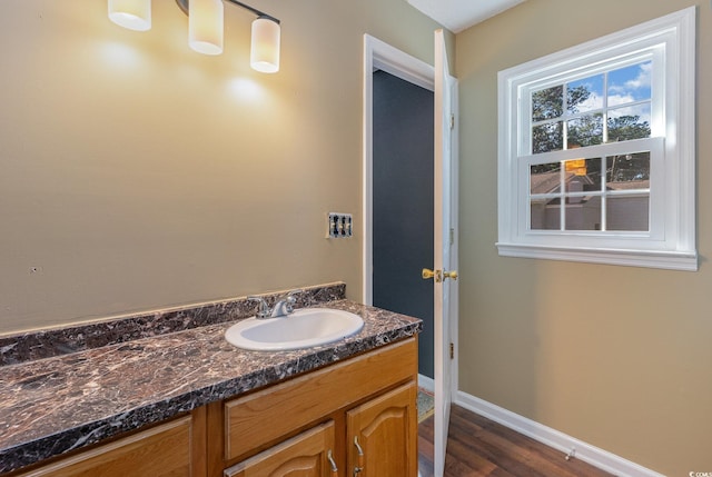 bathroom with vanity and hardwood / wood-style floors