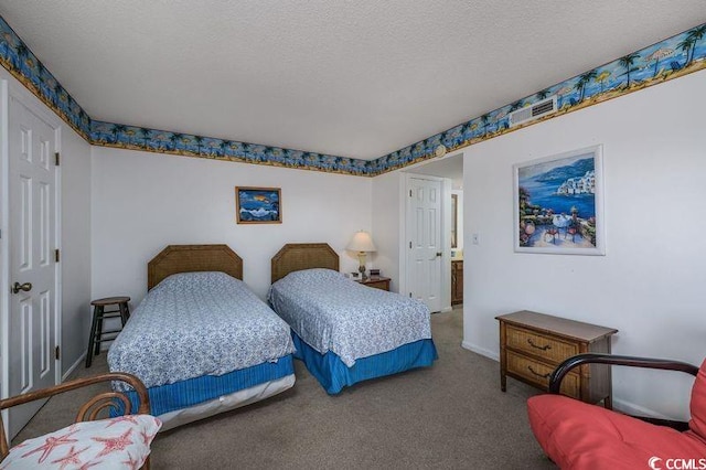 carpeted bedroom with a textured ceiling