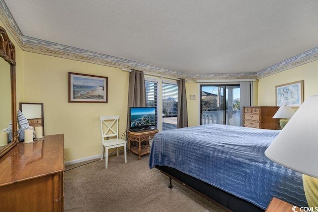 carpeted bedroom with access to outside and a textured ceiling