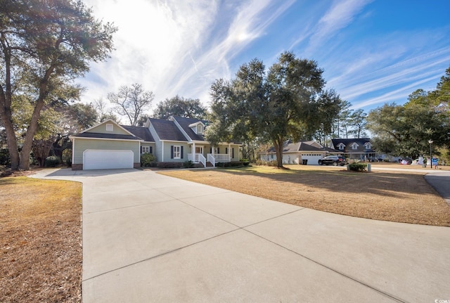 view of front of property with a front yard and a garage