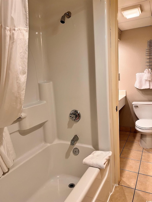 full bathroom with shower / bath combination with curtain, vanity, tile patterned floors, and toilet