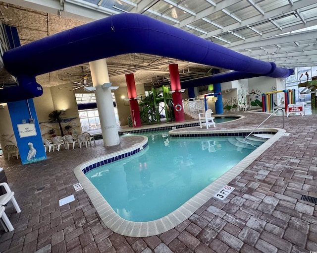 view of swimming pool with ceiling fan