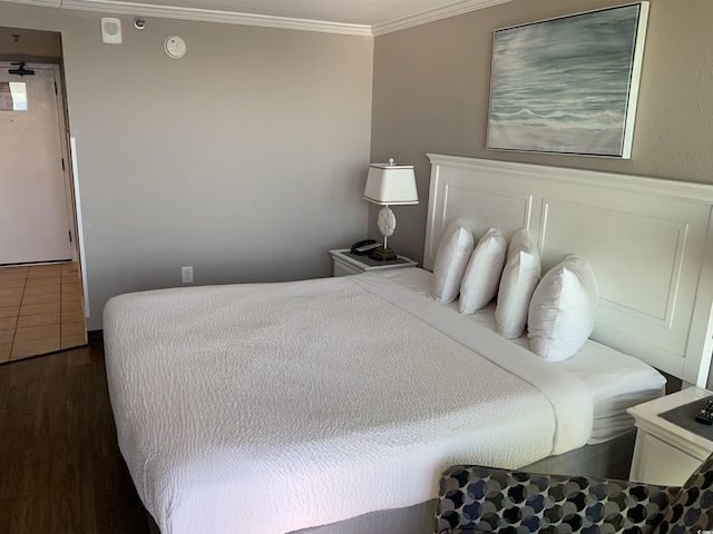 6900 N Ocean Blvd Unit 614, Myrtle Beach, SC 29572 - bedroom featuring ornamental molding and wood finished floors