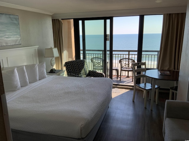 6900 N Ocean Blvd Unit 614, Myrtle Beach, SC 29572 - bedroom with a water view, access to outside, crown molding, dark wood-type flooring, and multiple windows