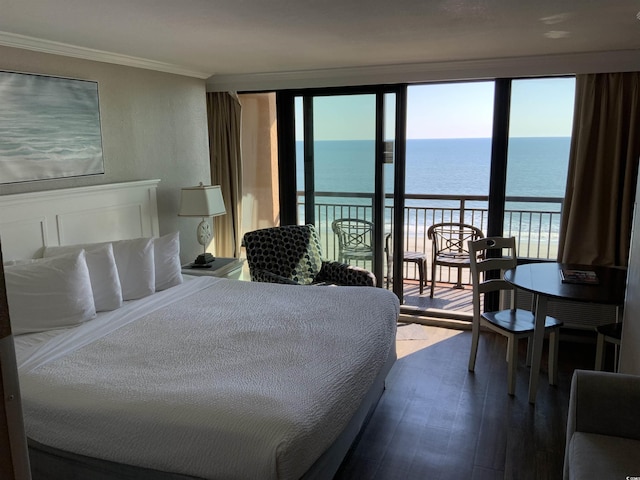 6900 N Ocean Blvd Unit 614, Myrtle Beach, SC 29572 - bedroom with a water view, access to exterior, dark wood-type flooring, and ornamental molding