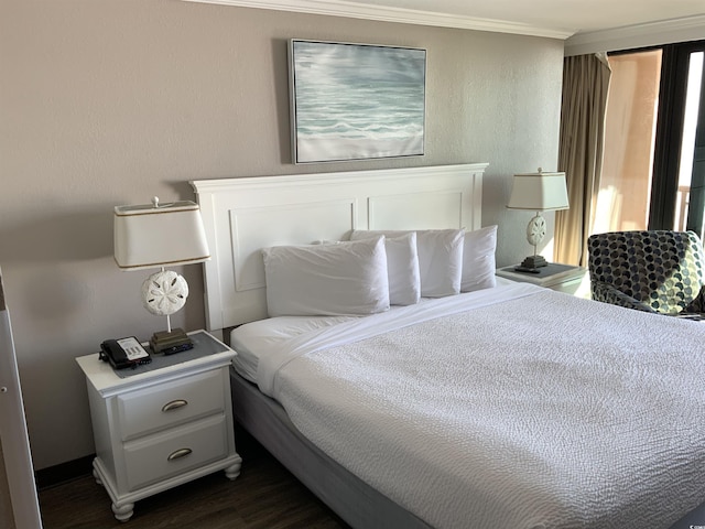6900 N Ocean Blvd Unit 614, Myrtle Beach, SC 29572 - bedroom featuring dark wood-style floors and crown molding
