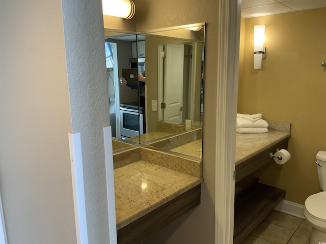 6900 N Ocean Blvd Unit 614, Myrtle Beach, SC 29572 - bathroom with toilet, tile patterned flooring, and vanity