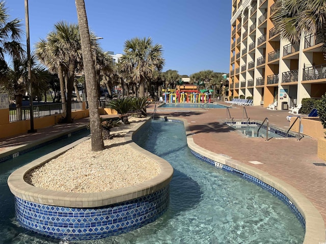 6900 N Ocean Blvd Unit 614, Myrtle Beach, SC 29572 - community pool with a hot tub and a patio
