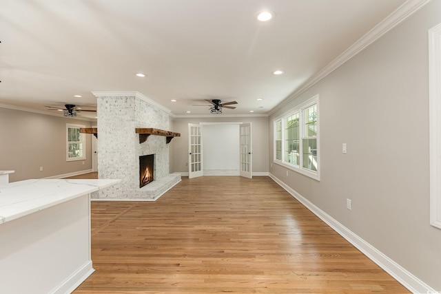 106 Governor Boone Ln, Georgetown, SC 29440 - unfurnished living room featuring recessed lighting, a ceiling fan, crown molding, and a large fireplace