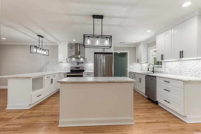 106 Governor Boone Ln, Georgetown, SC 29440 - kitchen with ornamental molding, decorative backsplash, appliances with stainless steel finishes, and wall chimney range hood