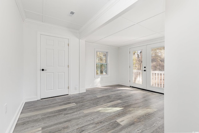 106 Governor Boone Ln, Georgetown, SC 29440 - interior space with crown molding, visible vents, wood finished floors, baseboards, and french doors