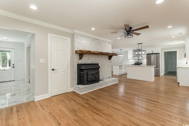 106 Governor Boone Ln, Georgetown, SC 29440 - unfurnished living room with crown molding, recessed lighting, and ceiling fan