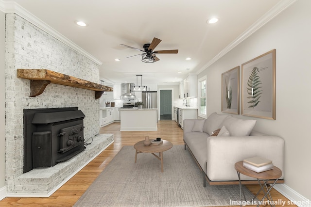 106 Governor Boone Ln, Georgetown, SC 29440 - living room with ornamental molding, baseboards, ceiling fan, recessed lighting, and light wood finished floors
