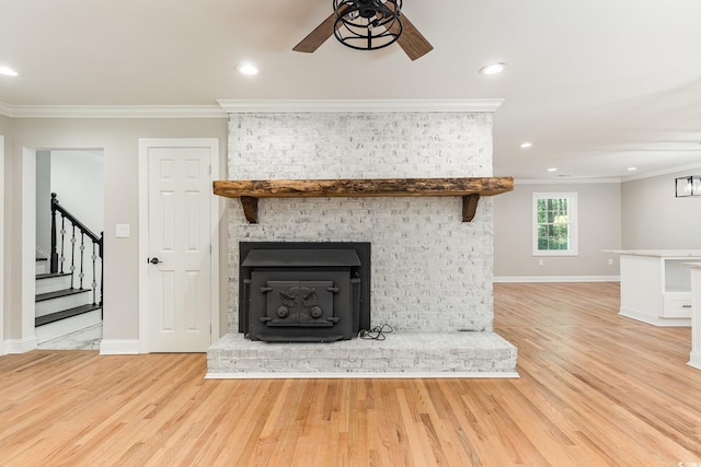 106 Governor Boone Ln, Georgetown, SC 29440 - unfurnished living room with crown molding, ceiling fan, stairs, and light wood finished floors