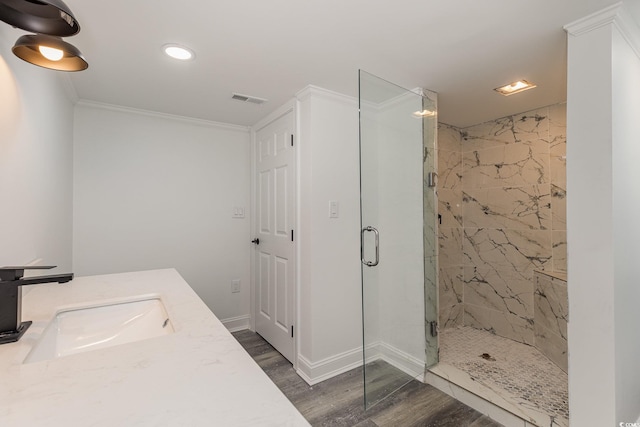 106 Governor Boone Ln, Georgetown, SC 29440 - bathroom featuring a marble finish shower, recessed lighting, wood finished floors, visible vents, and ornamental molding