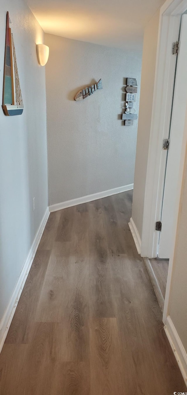 corridor featuring hardwood / wood-style flooring