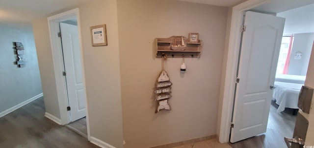 hallway featuring dark wood-type flooring