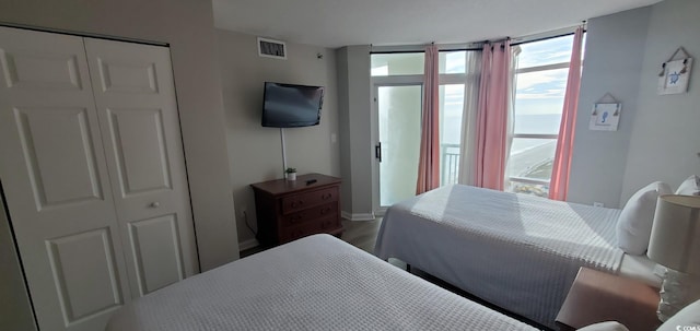 bedroom featuring hardwood / wood-style flooring and a closet