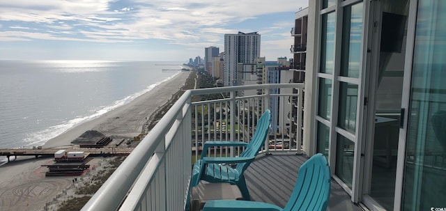 balcony featuring a water view